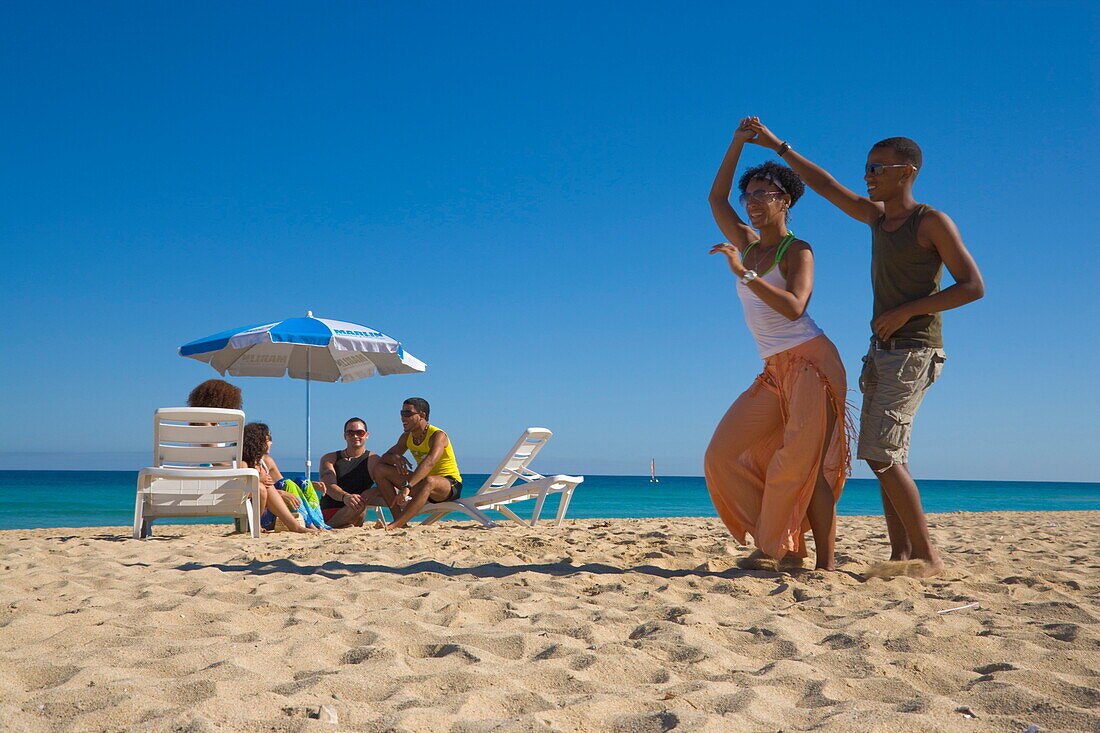 Young couple dancing salsa at beach, Playas del Este, Havana, Ciudad de La Habana, Cuba, West Indies