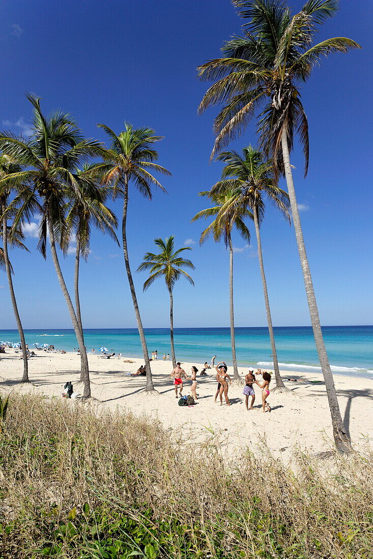 Young people dancing salsa at beach, Playas del Este, Havana, Ciudad de La Habana, Cuba, West Indies