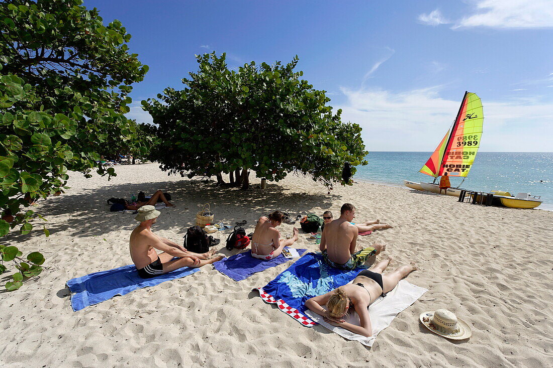 Tourists sunbathing at Playa Ancon, Trinidad, Sancti Spiritus, Cuba, West Indies