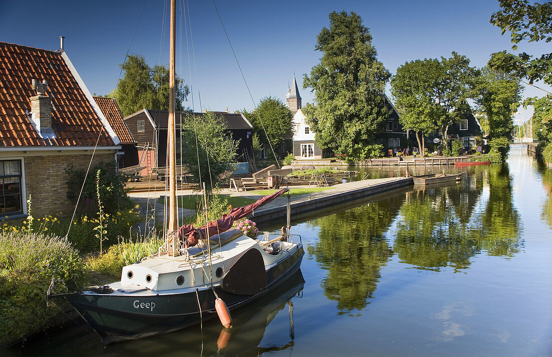 Canal with sailboat in Edam, Holland, Netherlands, Europe