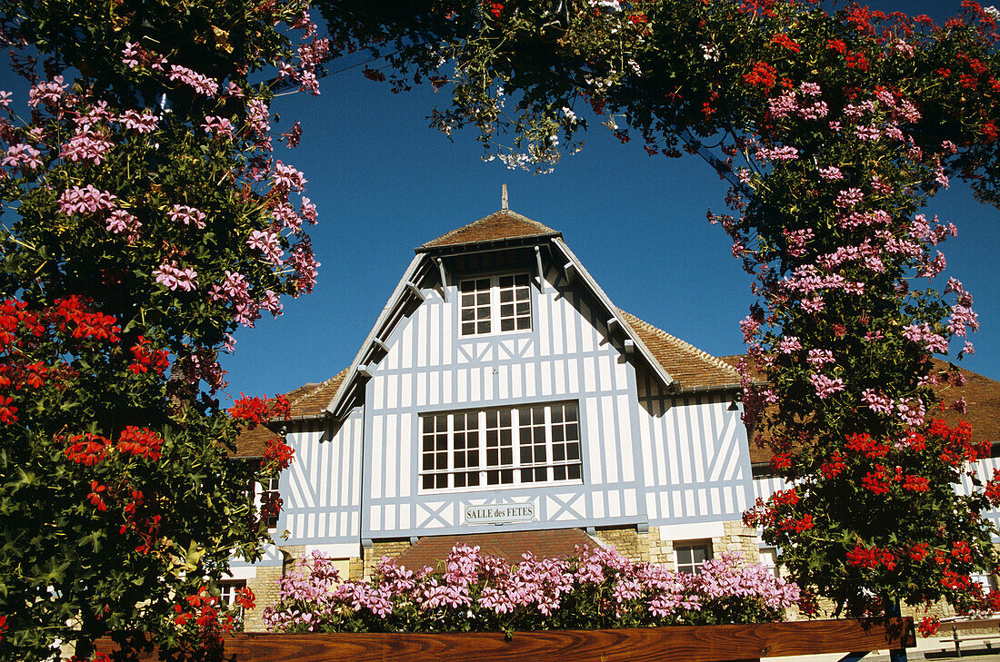 Saint Pierre Sur Dives, Normandy, France  Salle des Fetes through arch of colourful flowers