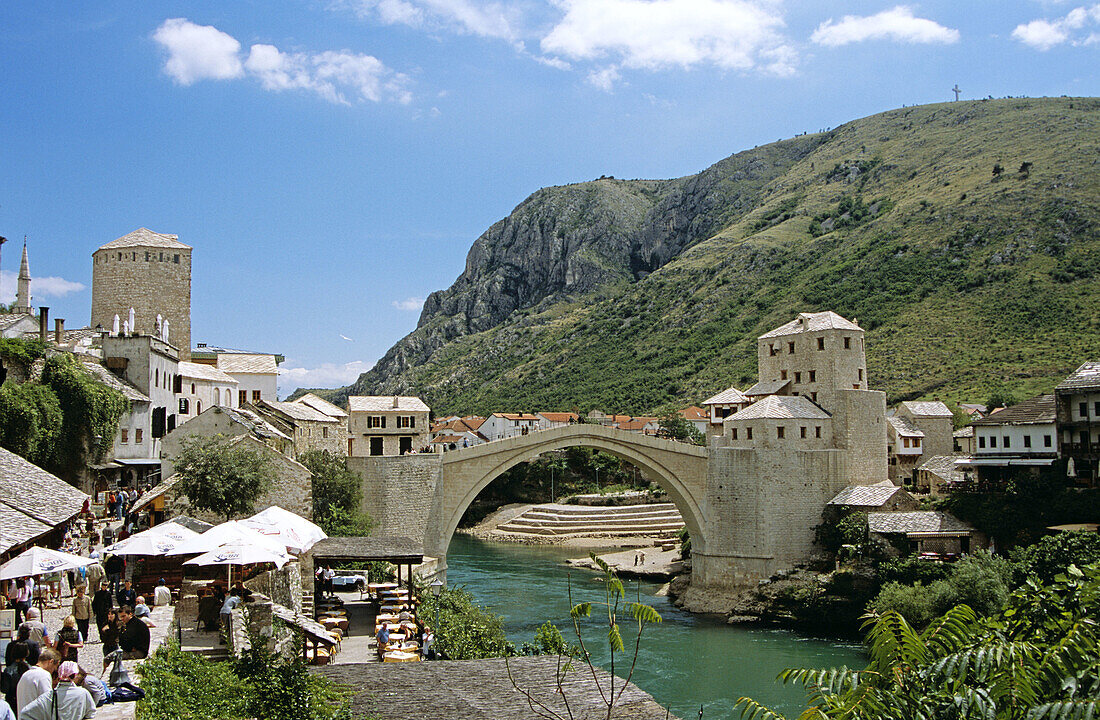 Stari Most, Old Bridge, following reconstruction, tourists, and Neretva River, Mostar, Bosnia Herzegovina, Former Yugoslavia