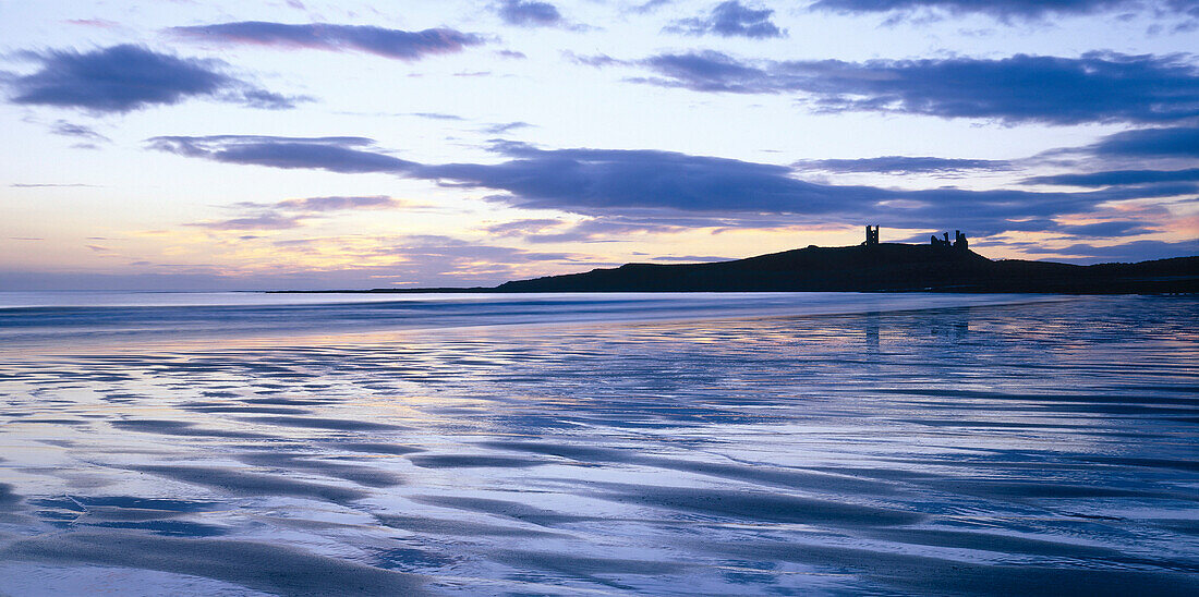 Dunstanburgh Castle at Sunset, Nr Craster, Northumberland, UK, England