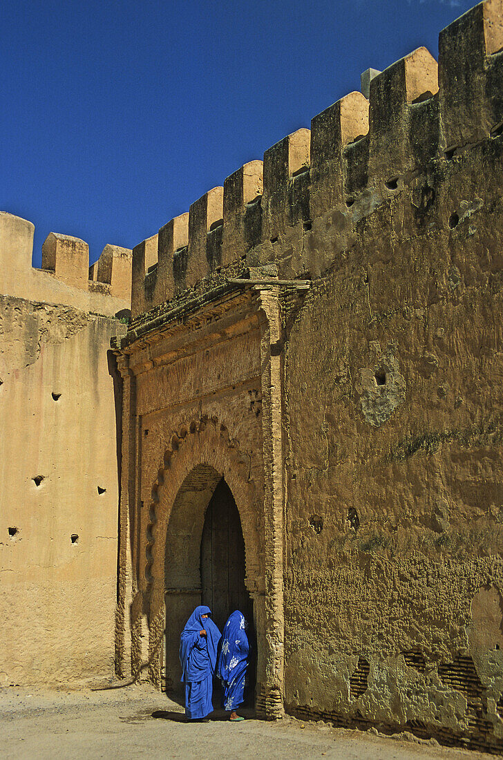 Morocco, Taroudannt, Rampart and gate with Moroccan women