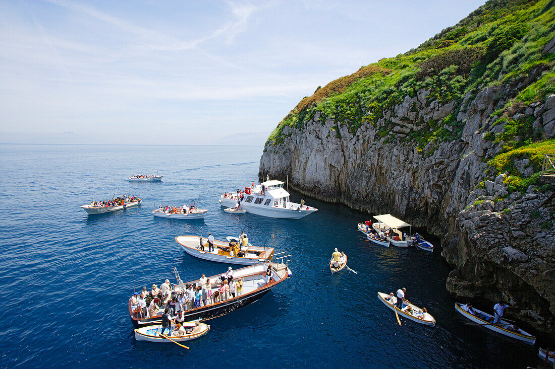 People in boats off the rocky coast, Capri, Italy, Europe