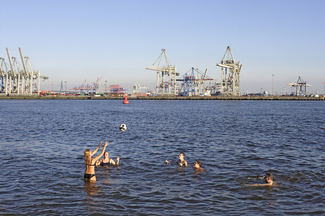 Young people bathing in Elbe river, Oevelgoenne, Hamburg, Germany