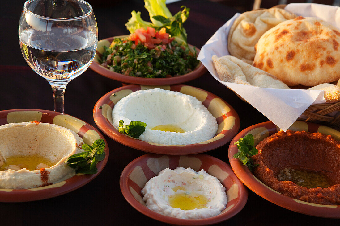 Mezze, bowls filled with appetizers and bread, Hilltop restaurant, Cairo, Egypt, Africa