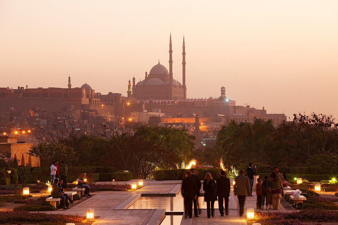 People strolling at Al Azhar Park, in the background the Citadel and the mosque of Muhammad Ali, Cairo, Egypt, Africa