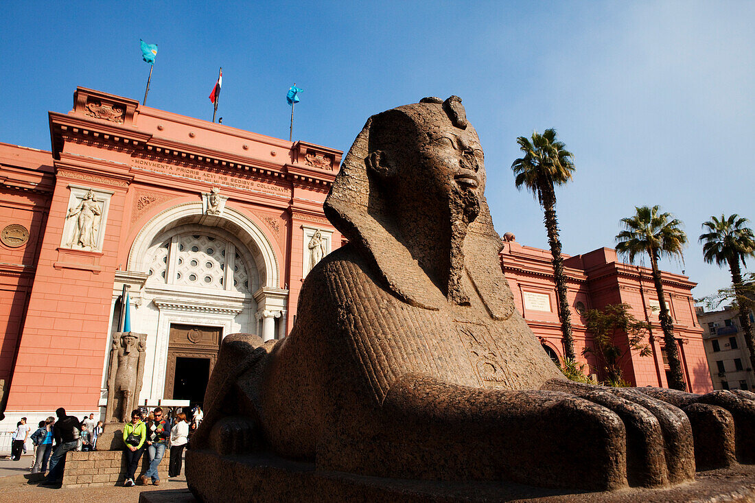 Sphinx in front of the facade of the Egytian museum in the sunlight, Cairo, Egypt, Africa