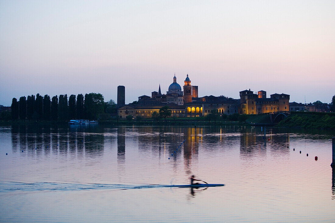 View over a lake at Palazzo Ducale and the Basilica di Sant'Andrea, Mantua, Lombardy, Italy, Europe