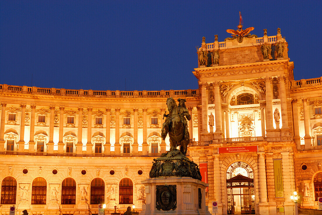 Eugene's monument in front of illuminated Hofburg Imperial Palace, Vienna, Austria