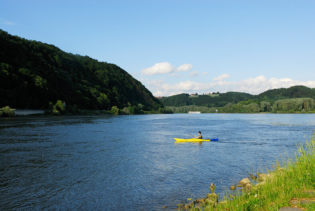Man kayaking on Danube river, Passau, Lower Bavaria, Bavaria, Germany