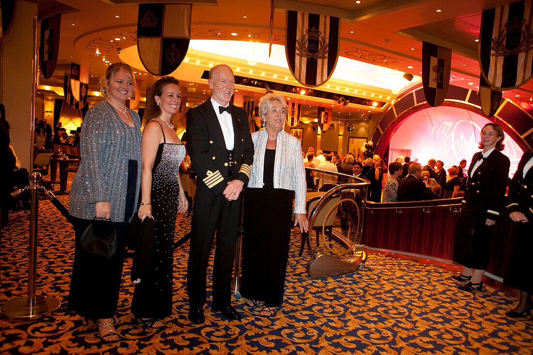 Captain Christopher Rynd with passengers in the Queens Room, Cruise liner, Queen Mary 2