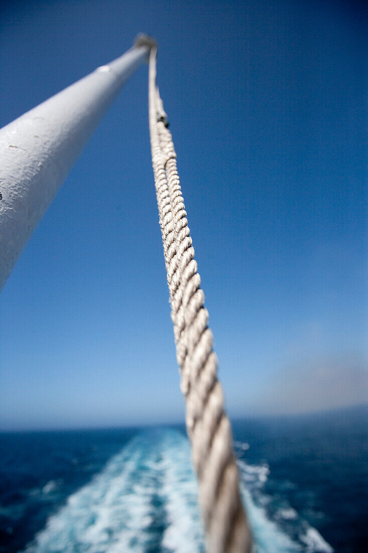 Flagpole at the stern of the ship with backwash, cruise liner, Queen Mary 2, Atlantic ocean, Transatlantic