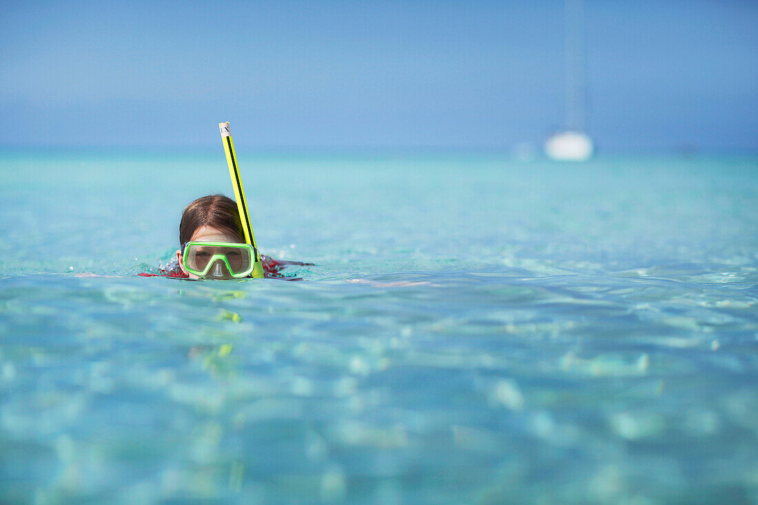 Girl snorkeling in the sea, Formentera, Balearic Islands, Spain