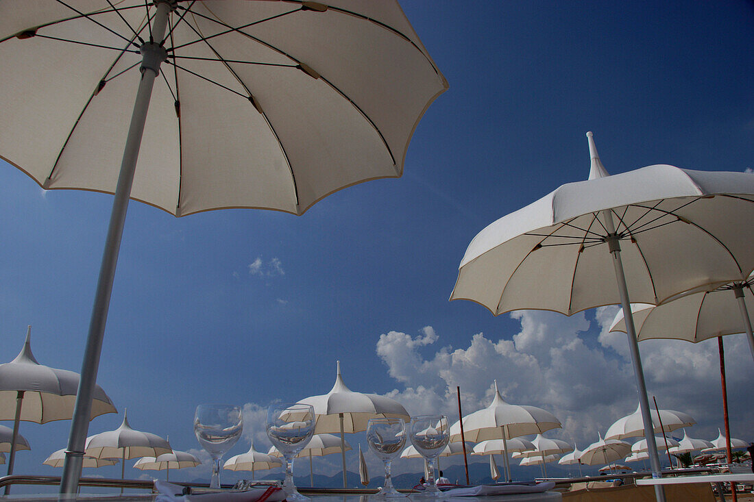Sun shades and wine glasses, Cannes, Cote d'Azur, France