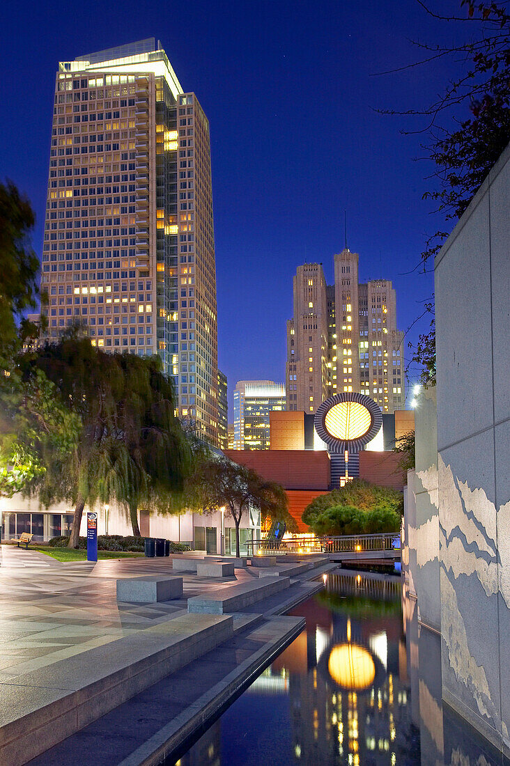 Esplanade Gardens and Museum of Modern Art at Yerba Buena Gardens at dusk, San Francisco, California, USA