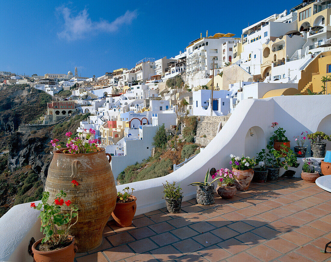 View of Hillside Town over patio, Fira, Santorini Island, Greek Islands