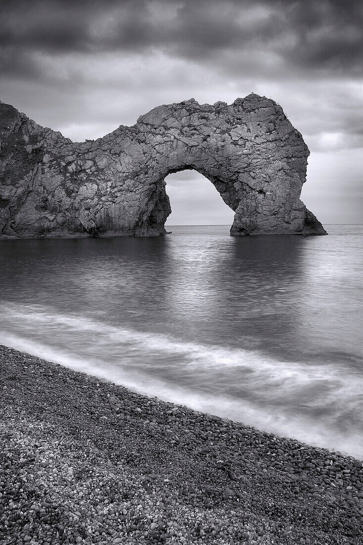 View of rock arch in sea, Durdle Door, Dorset, UK, England