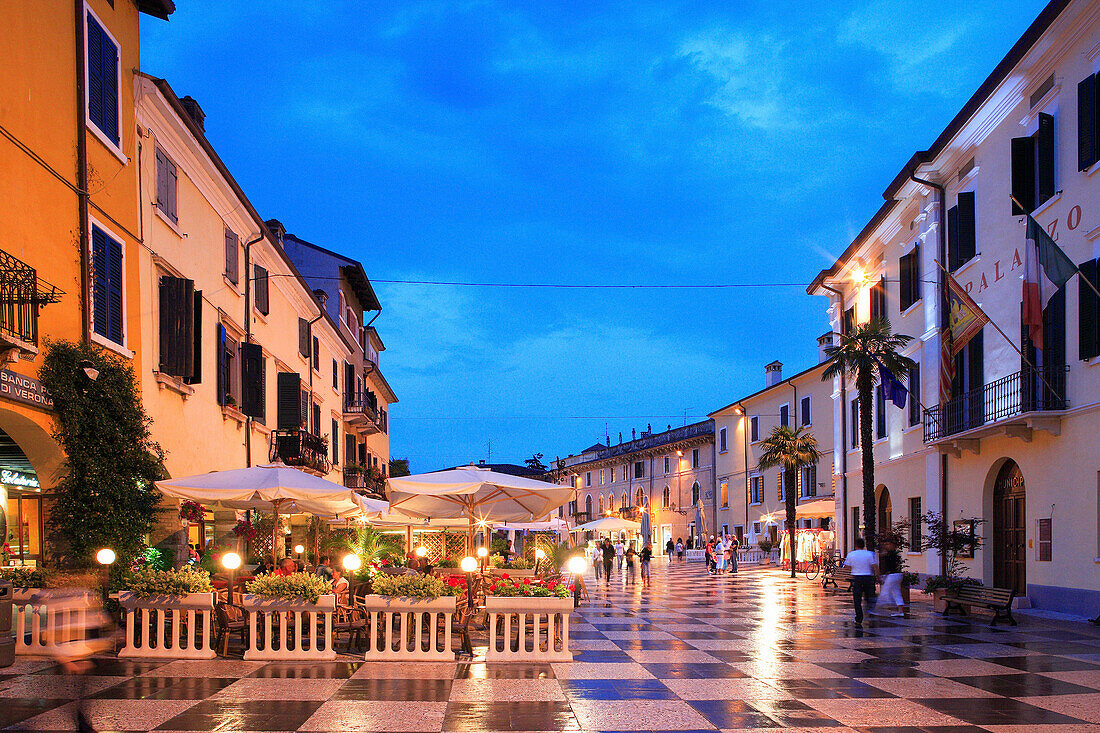 Cafe scene at night, Lazise, Lombardy, Lake Garda, Italy