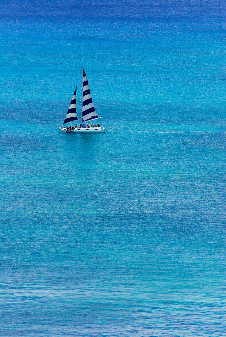 Yacht sailing on calm sea, Oahu Island, Hawaii, USA
