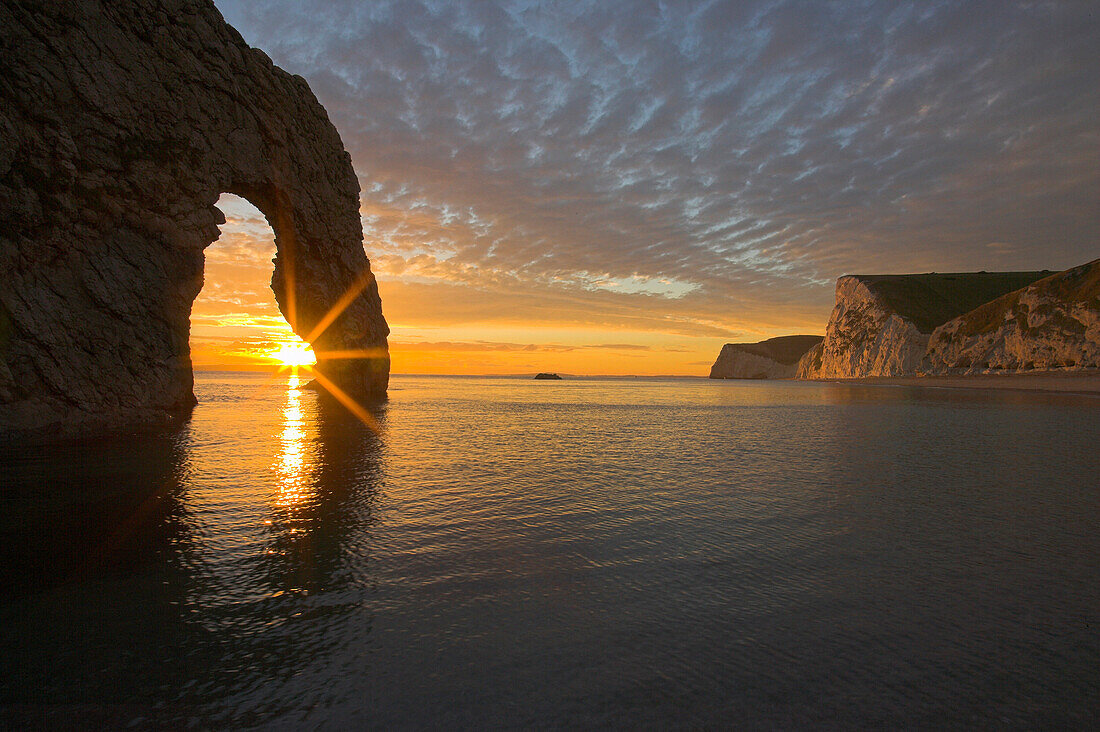 Rock arch at sunset, Durdle Door, Dorset, UK, England