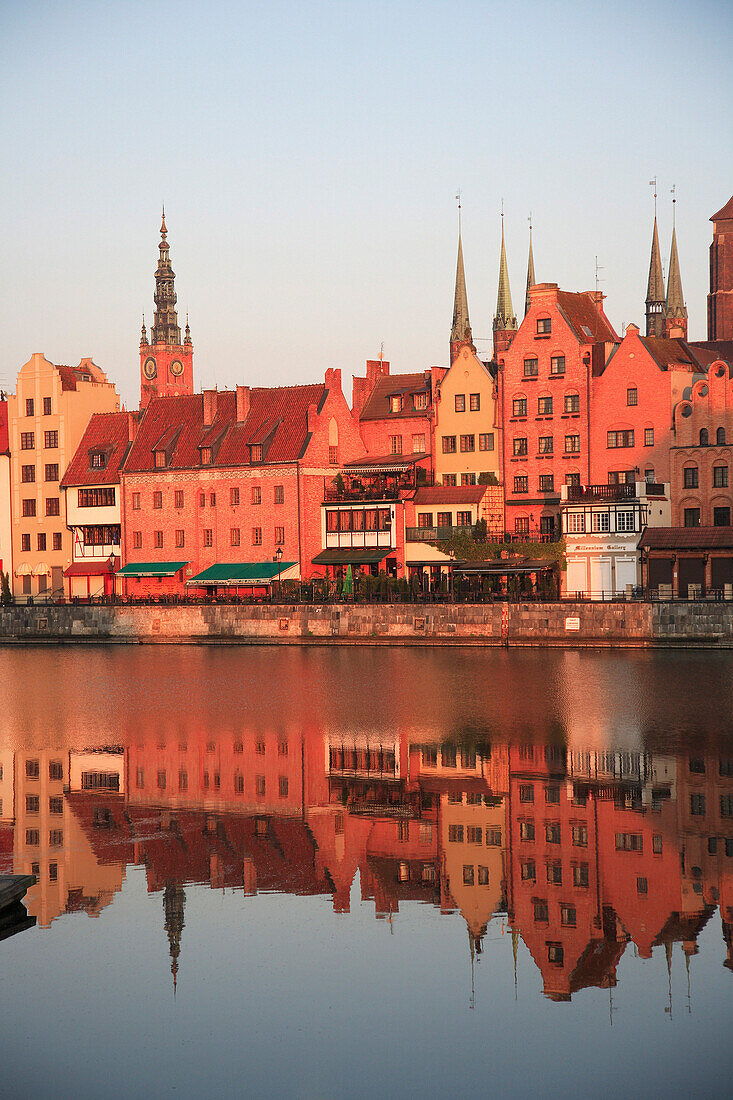 City skyline reflected in River Motlawa at sunrise, Gdansk, Poland