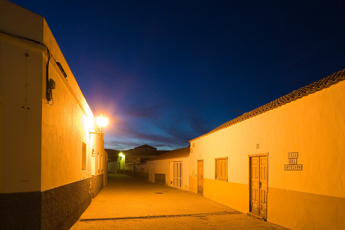 Illuminated deserted alley in the evening, Pajara, Fuerteventura, Canary Islands, Spain, Europe