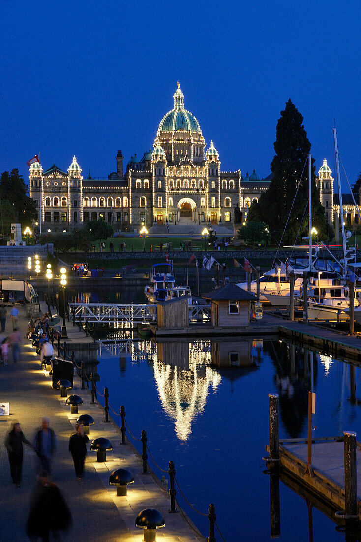 Victoria harbour and illuminated parliament at twilight in Victoria, Vancouver Island, Canada, North America