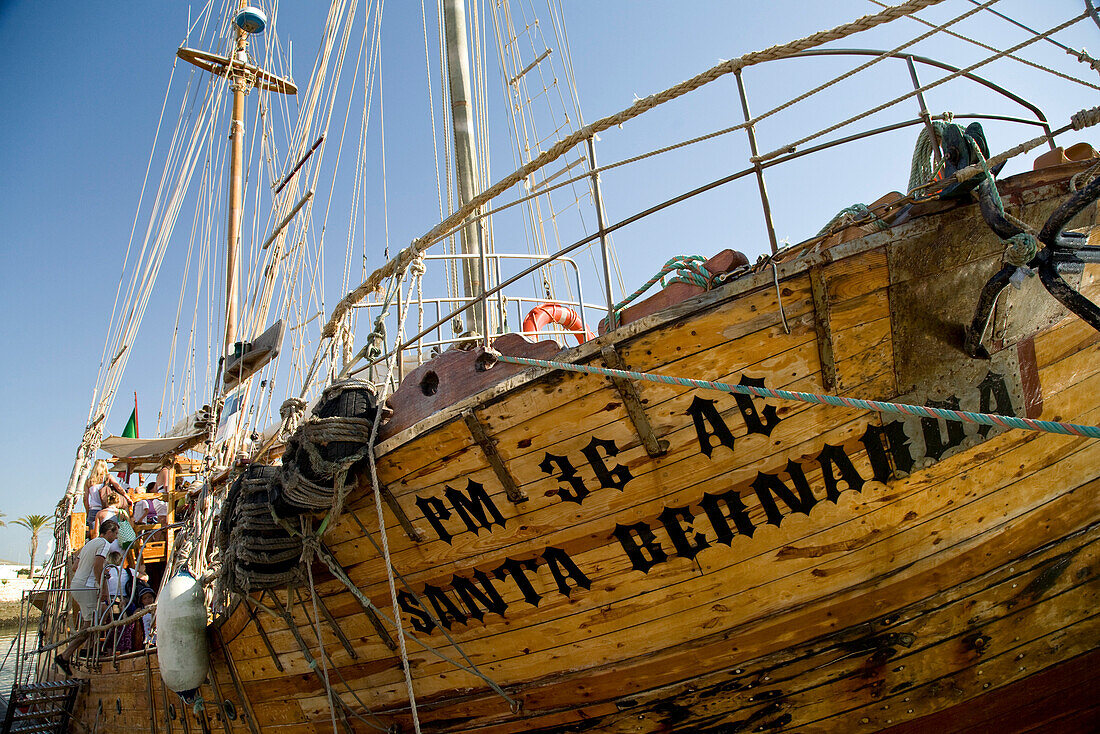 Sailing boat Santa Bernada, now taking tourists along the steep coast of the Algarve, Portimao, Algarve, Portugal