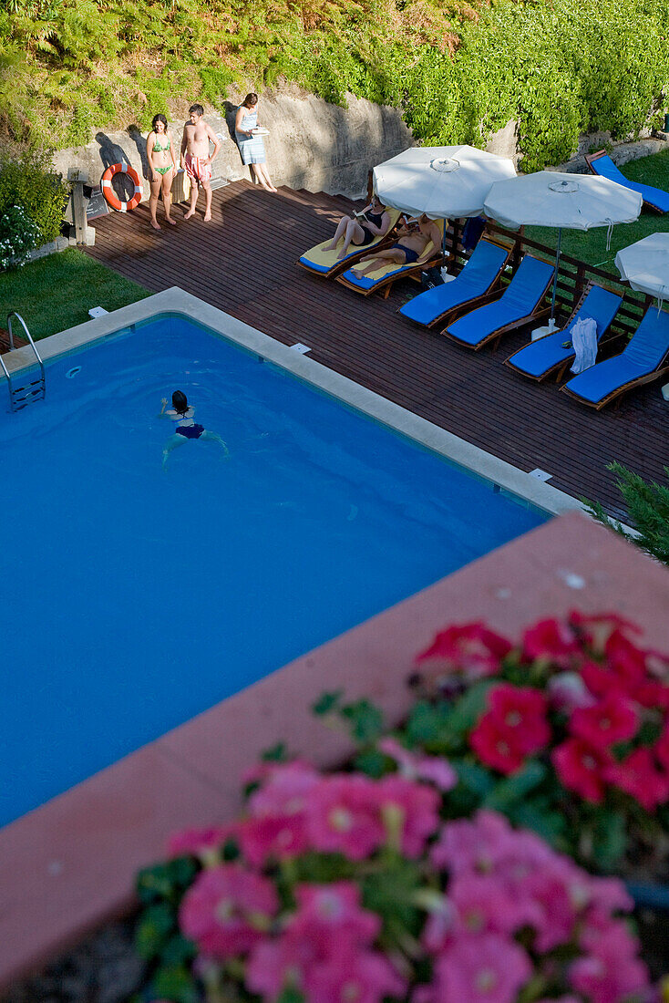 Guests in the outdoor swimming pool, Caldas de Monchique, hot springs and wellness resort, Monchique, Algarve, Portugal