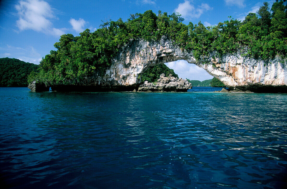 Natural stone arch in sea, Rock Islands, Palau, Micronesia