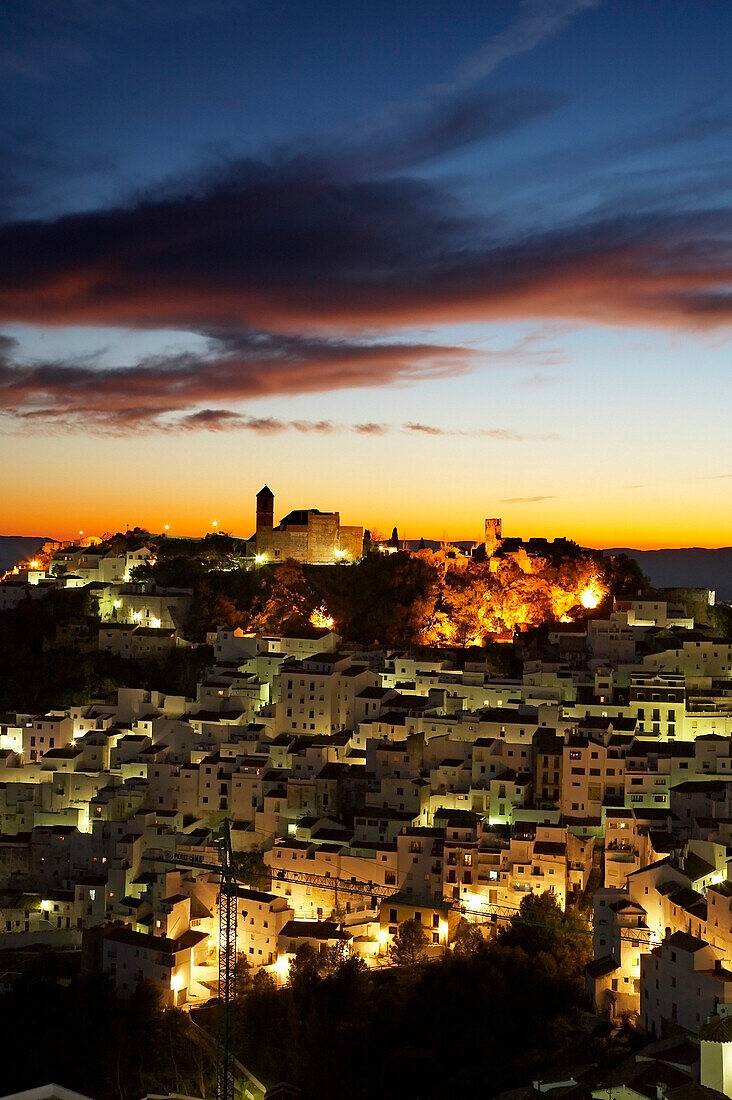 View over white hill town at dusk, Casares, Andalucia, Spain