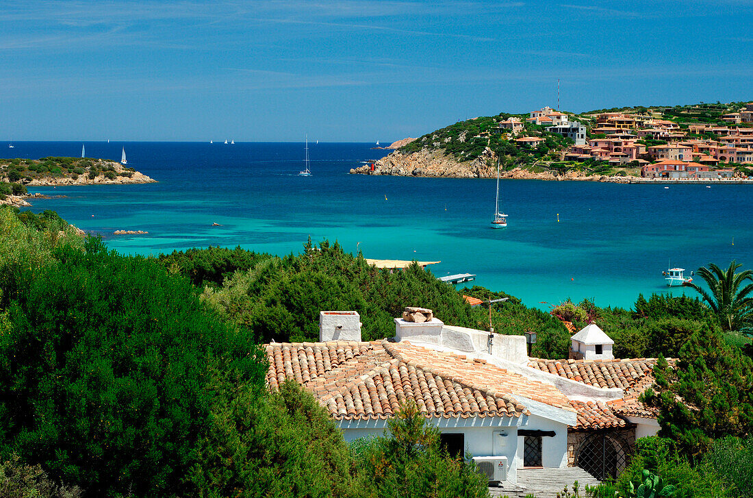 View of hillside town across bay, Porto Cervo, Sardinia, Italy