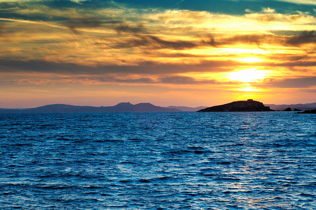 View across sea to the Maddalena Islands at dusk, Porto Piccolo, Sardinia, Italy