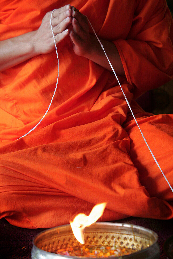 Buddhist monk performing the su khwan ceremony, General, Laos