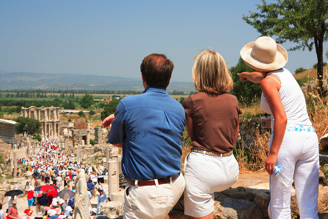 Tourists looking at Roman site, Ephesus, Aegean, Turkey