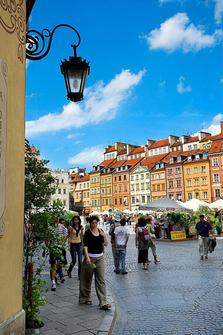 Tourists in the Old Town Square, Warsaw, Poland
