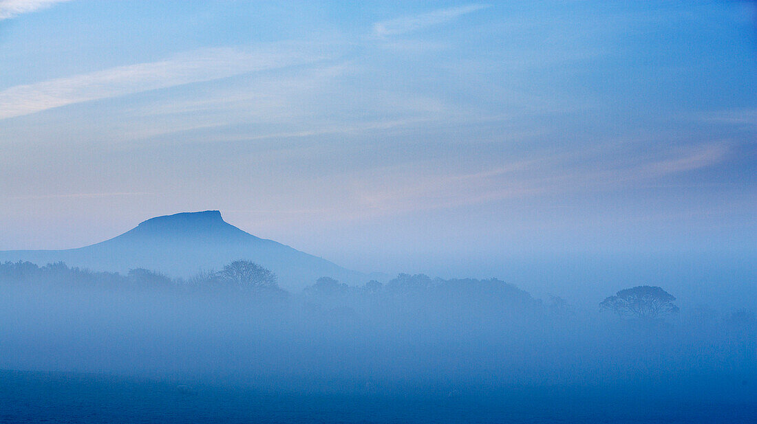Morning mist over Roseberry Topping, Great Ayton, near, Yorkshire, UK, England