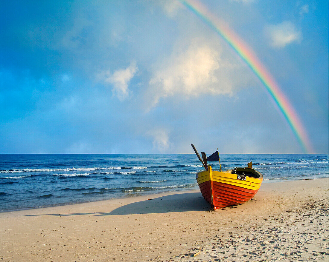 Beach scene with boat and rainbow, Gdansk, near, Poland
