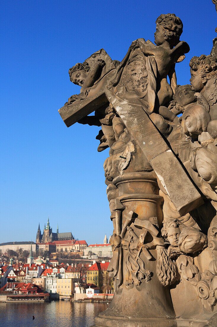 Statue on Charles Bridge and view to Castle, Prague, Czech. Republic