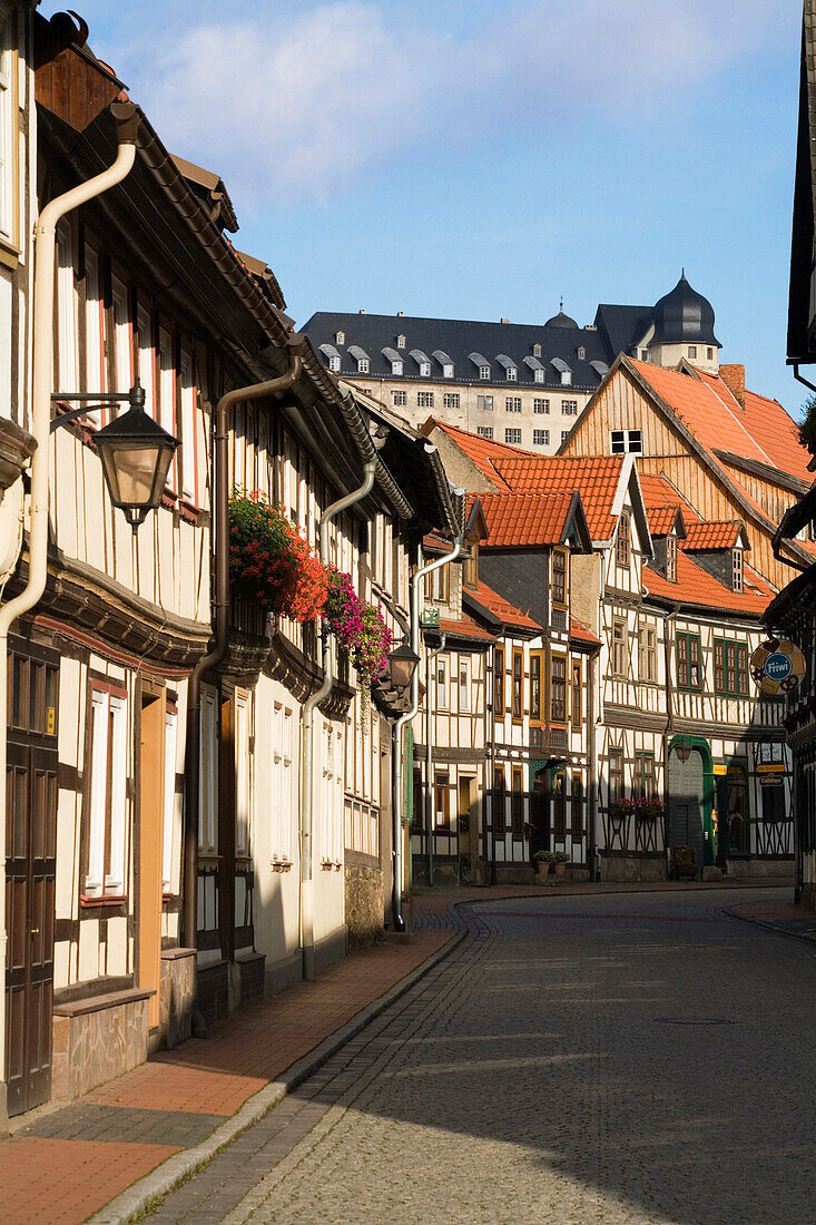 Street scene with half-timbered houses and Stolberg Castle, Stolberg, Saxony-Anhalt, Germany