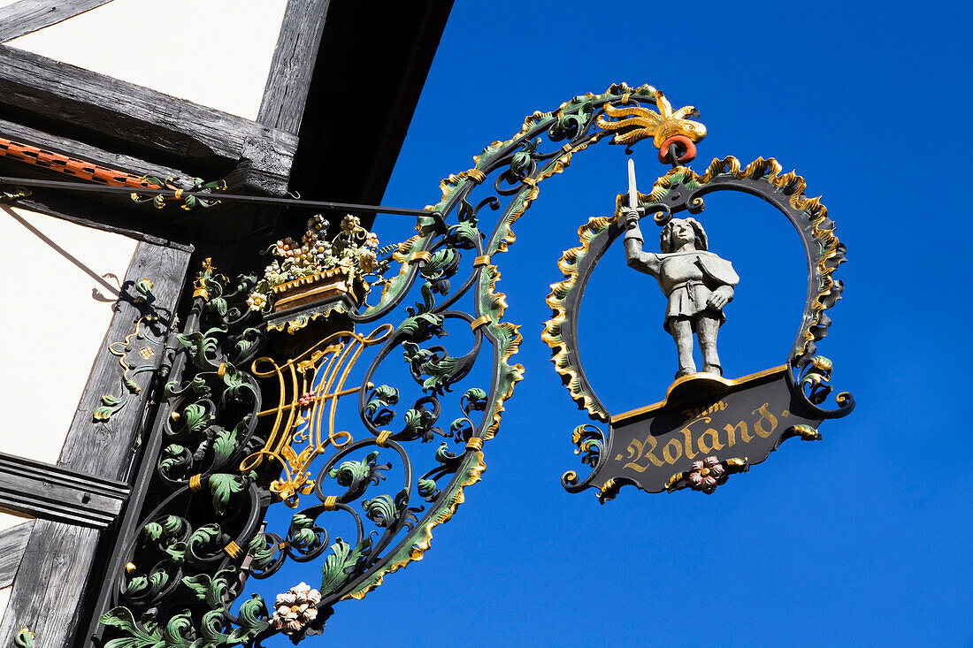 Wrought-iron Roland sign on half-timbered house, Quedlinburg, Saxony-Anhalt, Germany