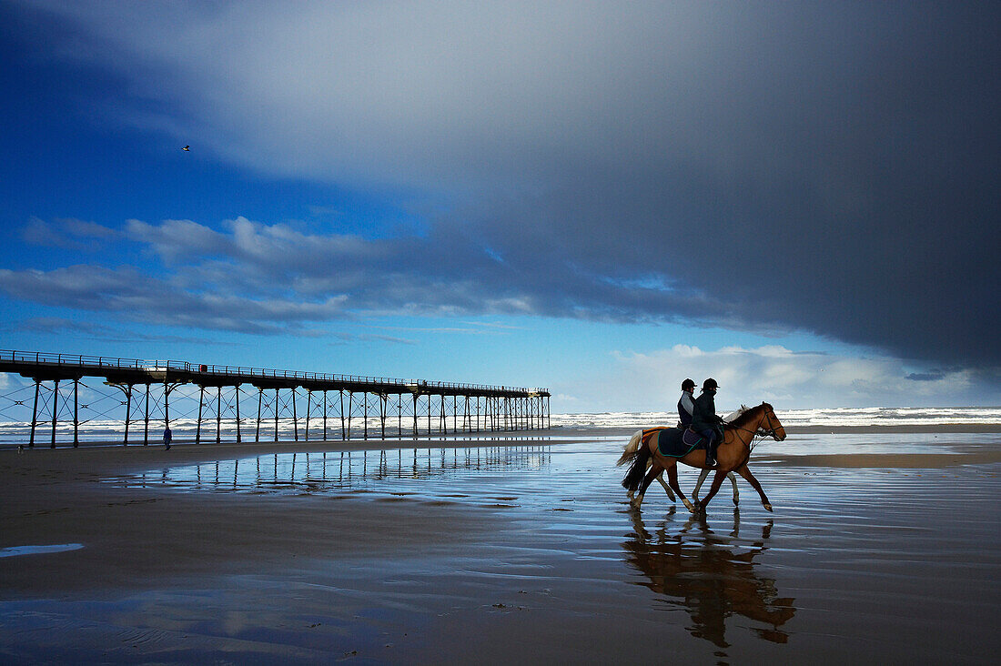 Horse riders on the beach, Saltburn, Cleveland, UK, England