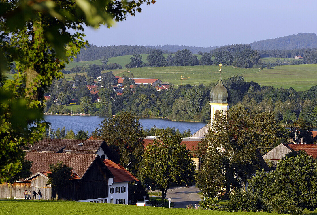 View over Froschhausen with Sankt Leonhard church at lake Riegsee, Bavaria, Germany