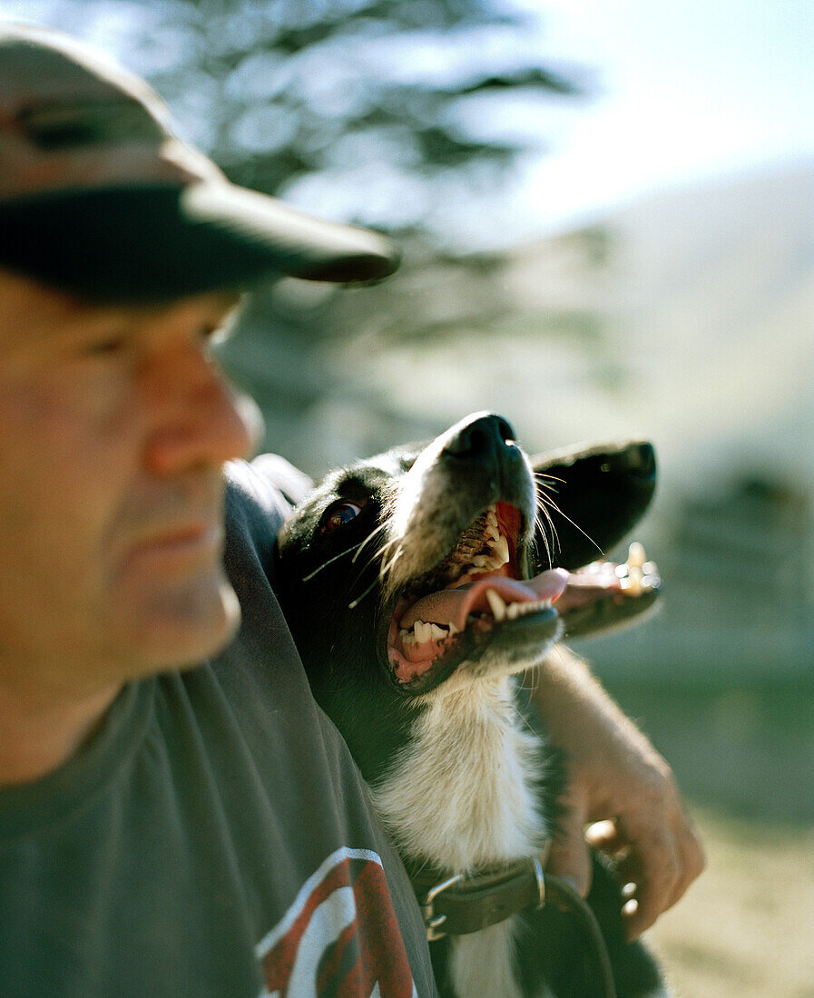 Shepherd Lou Thacker with sheepdogs, Rowendale Homestead, Okains Bay, Banks Peninsula, South Island, New Zealand