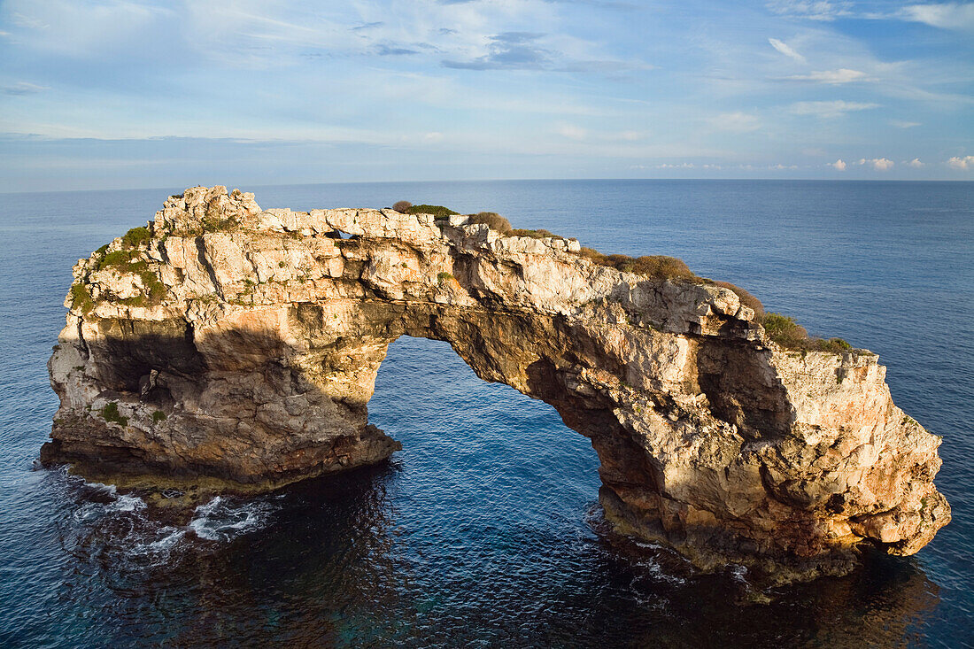 Archway of Es Pontas under clouded sky, Cala Santanyi, Mediterranean Sea, Mallorca, Balearic Islands, Spain, Europe