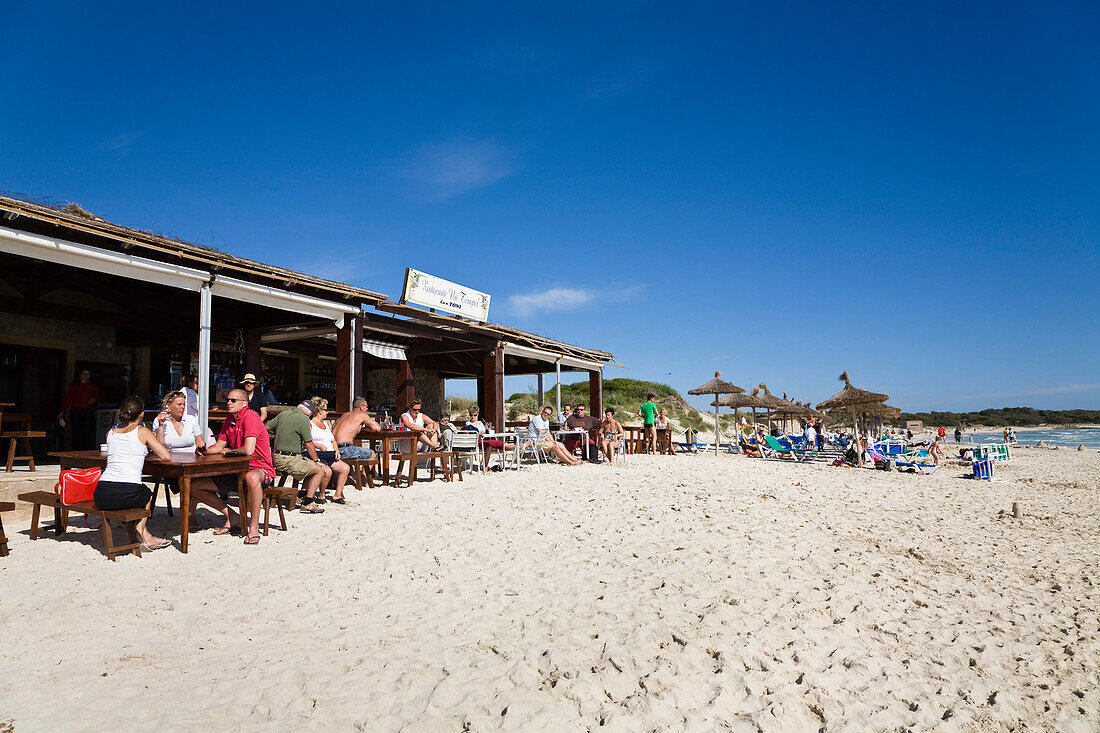 People sitting in a beach bar at the beach of Es Trenc, Mallorca, Balearic Islands, Spain, Europe