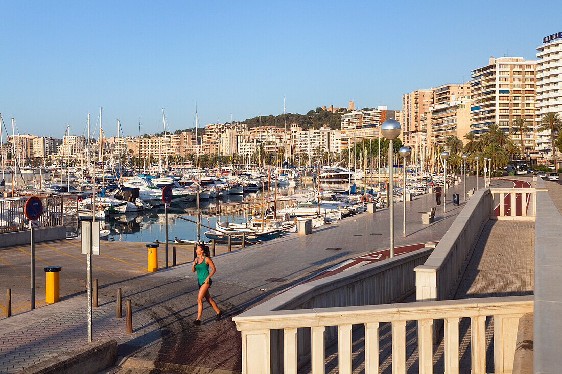 Jogger on seaside promenade at marina, Palma, Mallorca, Balearic Islands, Mediterranean Sea, Spain, Europe
