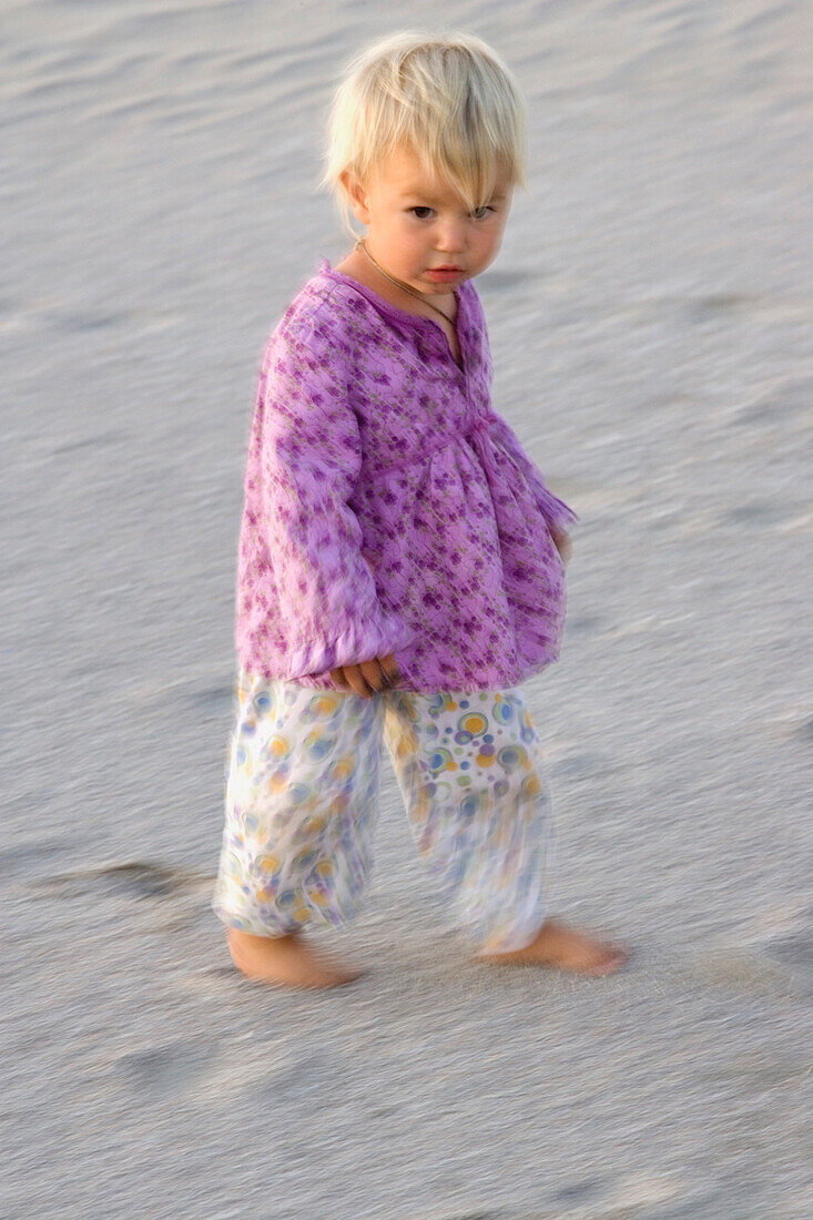 A little girl walking over the sandy beach, Punta Conejo, Baja California Sur, Mexico, America